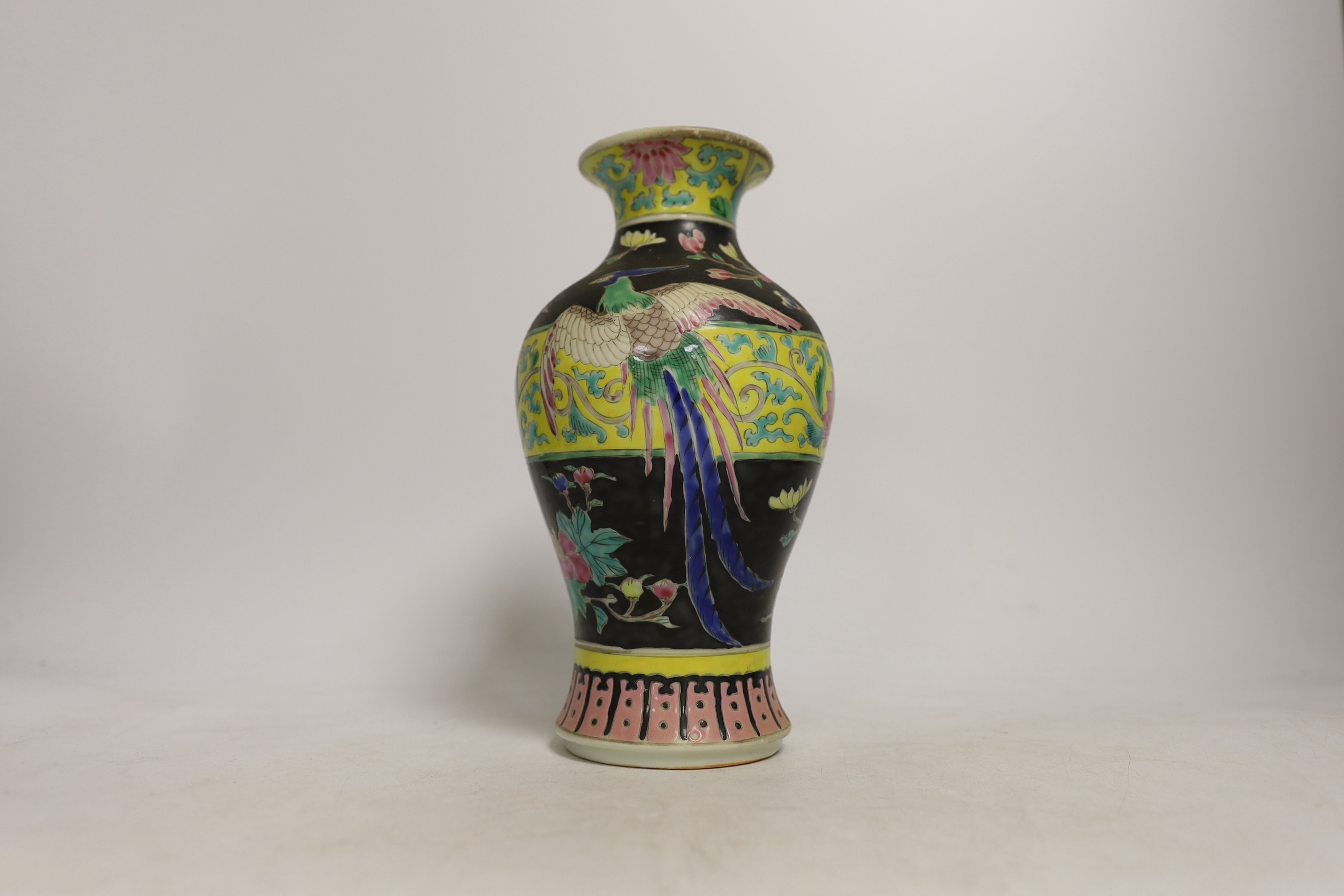 Chinese porcelain- a tall 19th century famille rose vase and cover, a famille rose jar, early 19th century probably made the Indian market, a famille noire jar and a Japanese vase, tallest 28cm high